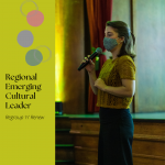 A woman is stood up talking to a crowd. She is holding a microphone. Text reads: Regional Emerging Cultural Leader, Regrouo 'n' Renew.