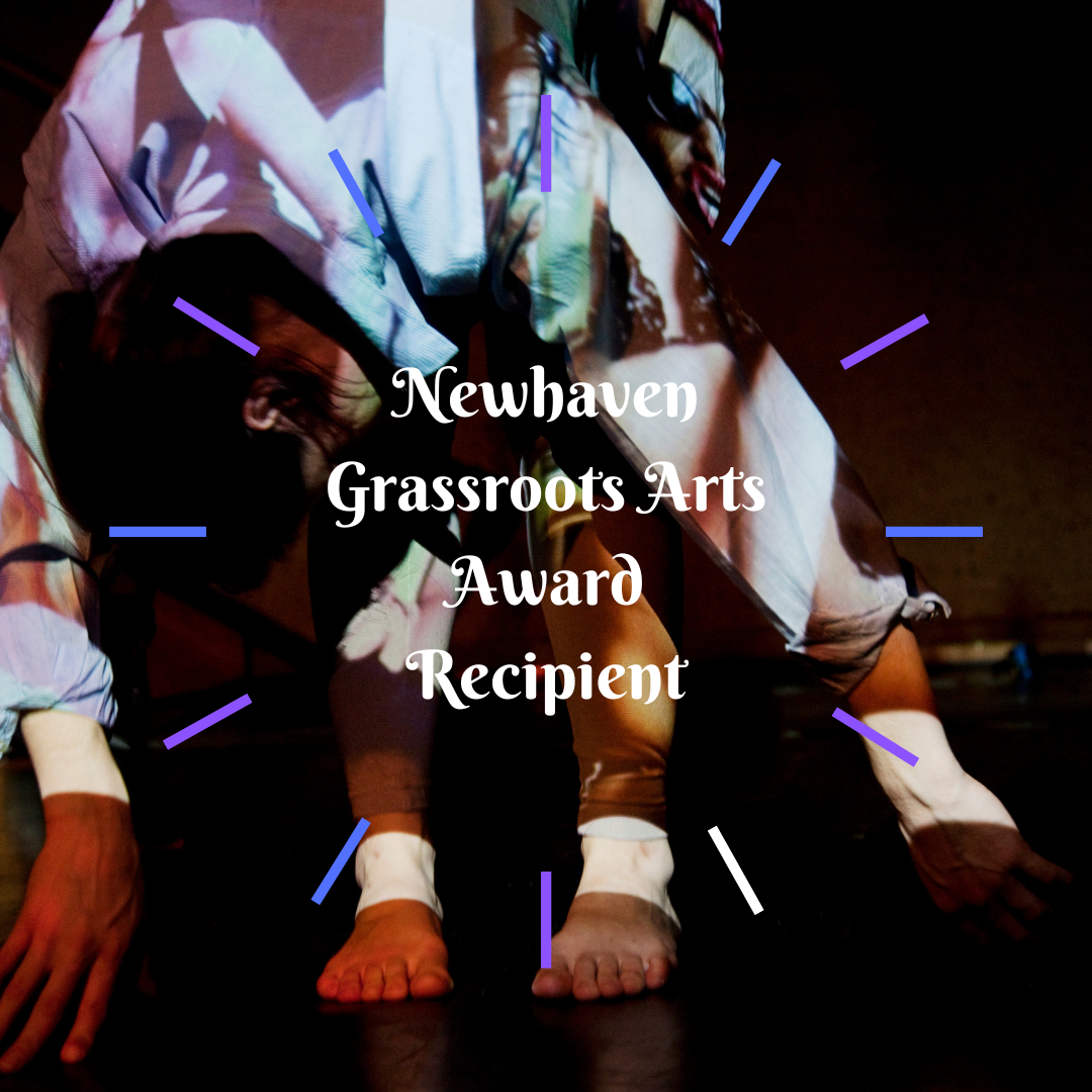 A women is leaning over. Her shirt has a projected image of herself on it. Text reads 'Newhaven Grassroots Arts Award Recipient' in white.