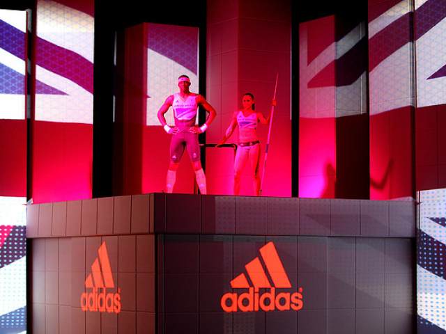 two people on stage on Adidas podium.
