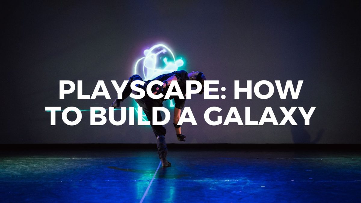 a person standing on a stage with the words playscape how to build a galaxy.